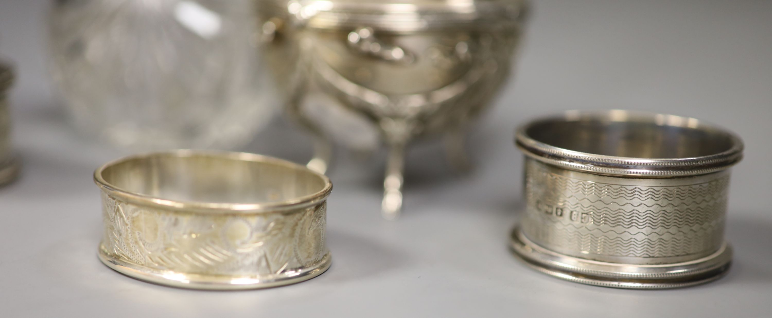 An Edwardian silver and glass globular scent bottle, a Continental cauldron shaped salt and four napkin rings